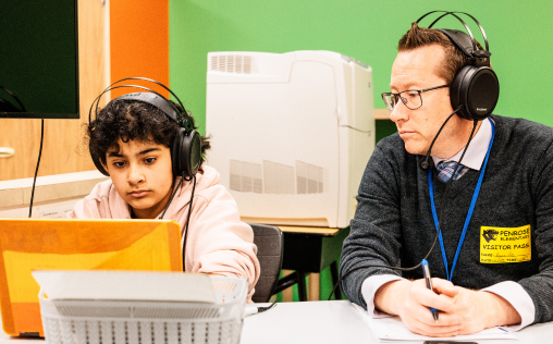 Educator watching student in online learning session