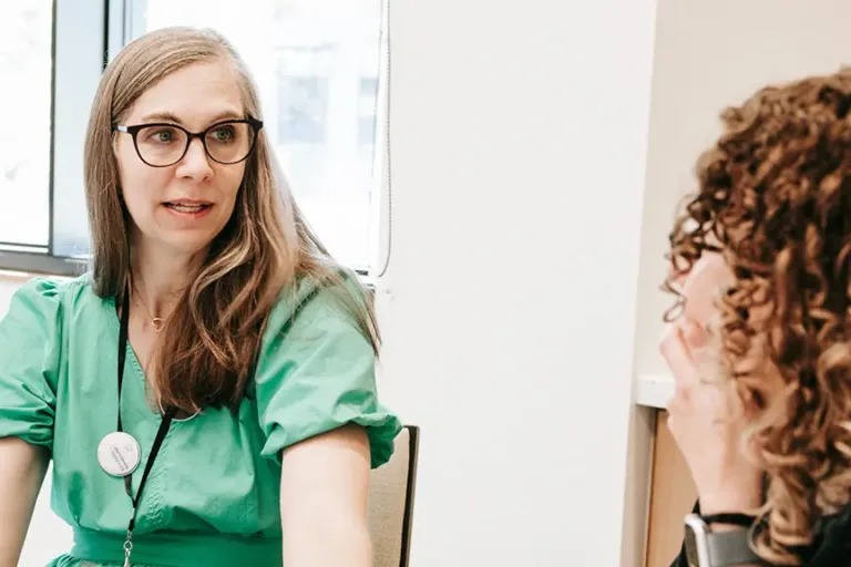 Woman coaching another person