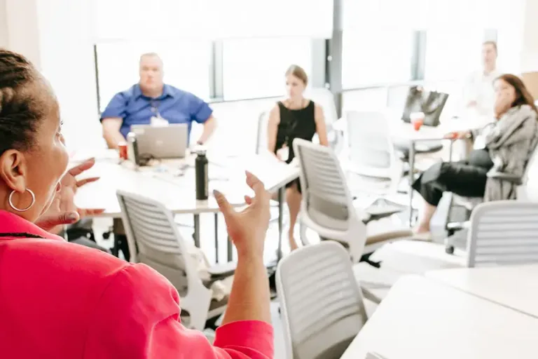 Woman teaching a room of people